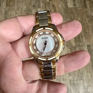Women’s Bulova two tone with diamonds mother of pearl face